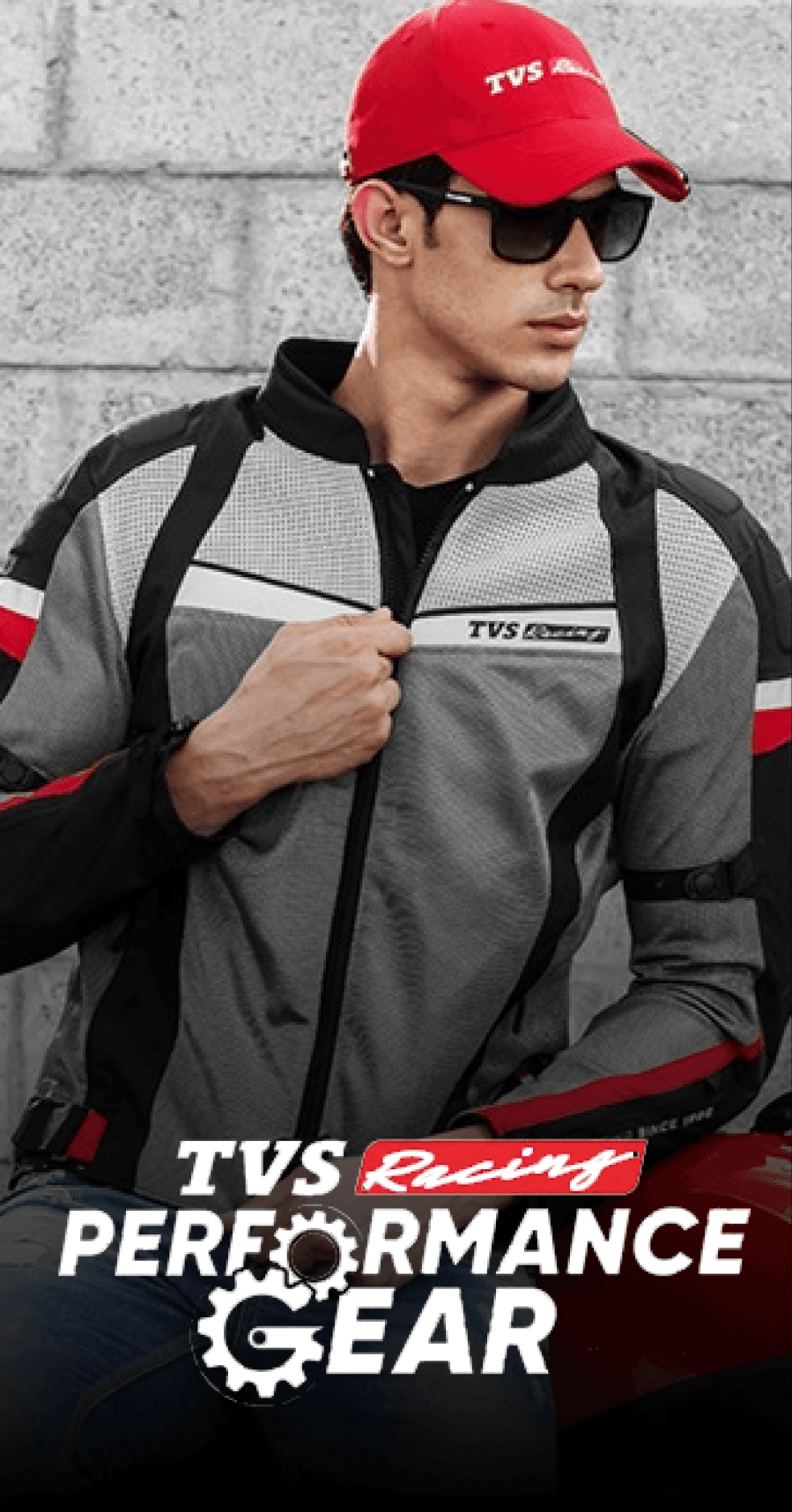 TVS Racing Performance Gear model wearing a branded cap and jacket